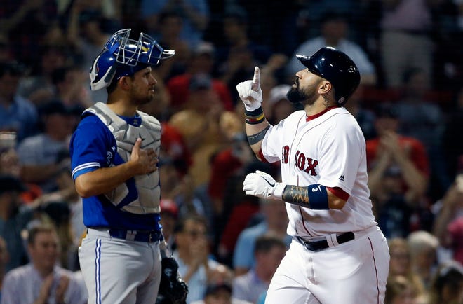 Associated press photos

Red Sox catcher Sandy Leon, right, celebrates his two-run home run in front of Toronto Blue Jays’ Luke Maile during the eighth inning of Tuesday’s game in Boston.