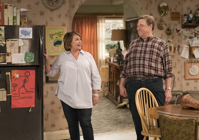 This image shows Roseanne Barr, left, and John Goodman in a scene from the comedy series "Roseanne."