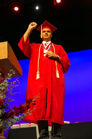 DeanJames Garcia D'Angelo, valedictorian of the FSDB Deaf High School, celebrates at the school's graduation May 18. [CONTRIBUTED]