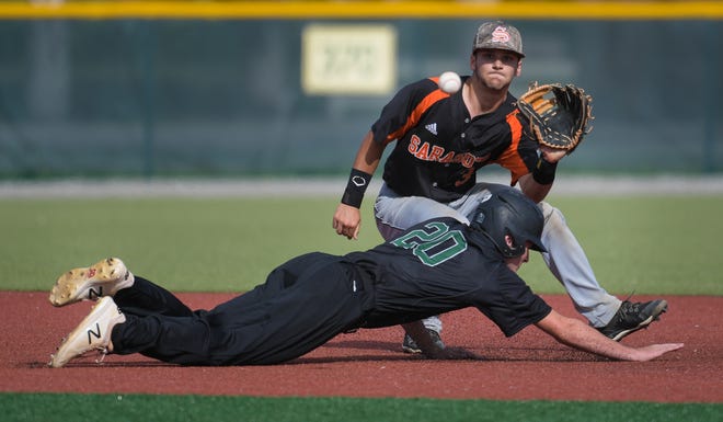 Sarasota High's Nick Winkelmeyer waits for the ball in a Class 8A regional semifinal game as Lakewood Ranch High's John Schroeder dives back to second base on May 16. [Herald-Tribune staff photo / Dan Wagner]