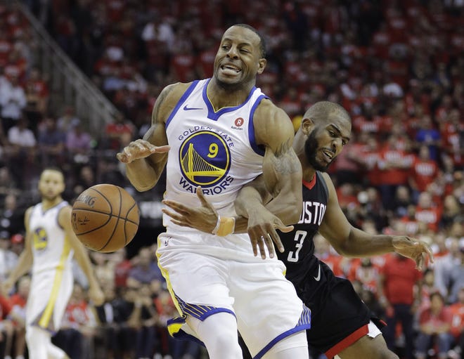 Golden State Warriors forward Andre Iguodala (9) is fouled by Houston Rockets guard Chris Paul (3) during the second half of Game 1 of the NBA basketball Western Conference Finals, Monday, May 14, 2018, in Houston. [David J. Phillip/The Associated Press]