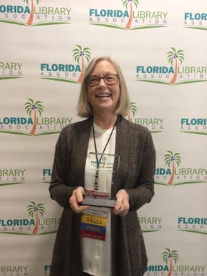 Heather Ogilvie, outreach librarian for the Bay County Public Library in Panama City, was honored for her community service. [CONTRIBUTED PHOTO]