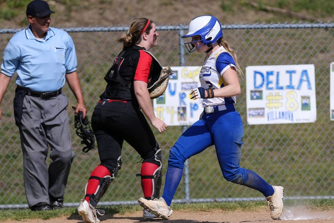 Norwood's Bryn Garczynski crosses the plate during a 5-0 win over Brockton on Friday. Wicked Local Photo/Dan Holmes