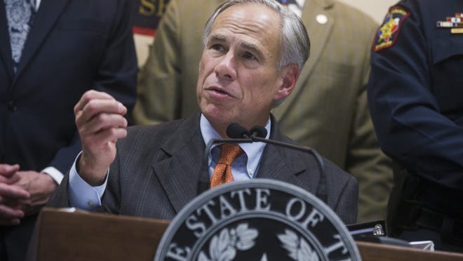 Gov. Greg Abbott, joined by state and local leaders, unveils a plan to enhance school safety in Texas during a news conference at the Hays County Law Enforcement Center on Wednesday in San Marcos.
