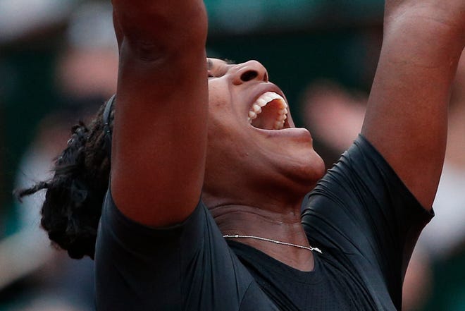 Serena Williams of the U.S. celebrates winning her second round match of the French Open tennis tournament against Australia's Ashleigh Barty in three sets, 3-6, 6-3, 6-4, at the Roland Garros stadium in Paris, France, Thursday, May 31, 2018. (AP Photo/Thibault Camus)