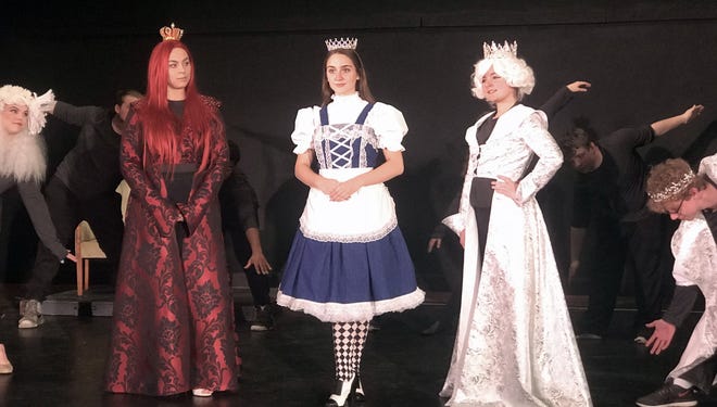 Sam Rose, center left, Audrey Ward, center, and Sami Deufel, center right, rehearse a scene for "Alice Through the Looking Glass," the Footlights Theatre Program's sixth annual youth production premiering this weekend. [CONTRIBUTED PHOTO]