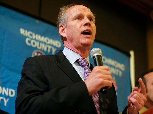 FILE - In a May 5, 2015 file photo, Staten Island District Attorney Dan Donovan thanks supporters while giving an acceptance speech during an election night gathering, in the Staten Island borough of New York after he won the 11th Congressional District seat vacated in January by former Congressman Michael Grimm. President Donald Trump endorsed U.S. Rep. Donovan Wednesday, May 30, 2018, but in doing so he misstated the New York Republican's record on taxes.(AP Photo/Julie Jacobson, File)
