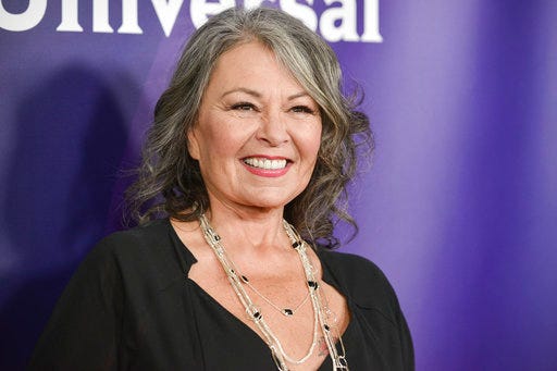 FIlE - In this April 8, 2014 file photo, Roseanne Barr arrives at the NBC Universal Summer Press Day in Pasadena, Calif. The unprecedented sudden cancellation of ABC's TV’s top comedy "Roseanne" has left a wave of unemployment and uncertainty in its wake. Barr’s racist tweet and the almost immediate axing of her show put hundreds of people out of work. (Photo by Richard Shotwell/Invision/AP, File)