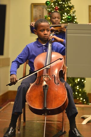 Michael Roberson, a Milton seventh-grader at Pierce Elementary School, plays cello.