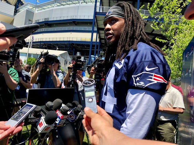 Dont'a Hightower talks with the media on Thursday.