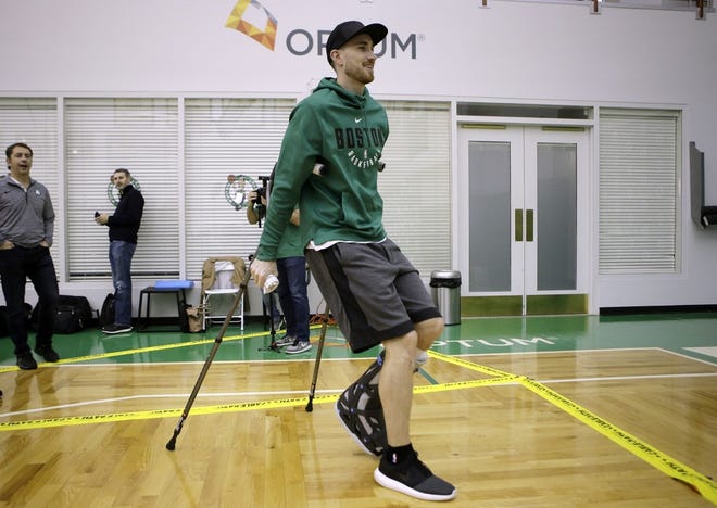 Boston Celtic Gordon Hayward uses crutches as he arrives at a news conference to take questions from members of the media, Thursday, Nov. 2, 2017 at the Celtics' training facility in Waltham, Mass. Hayward broke his left ankle Oct. 17, 2017, while playing in Cleveland against the Cavaliers.