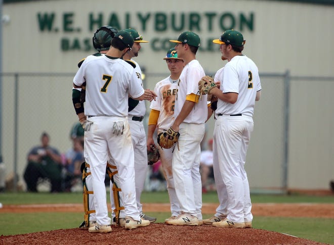 Crest HIgh pitching coach Brandon Powell talks to starting pitcher Riley Cheek and the Chargers' infield during their 2-1 third round playoff win over Alexander Central. [Brittany Randolph/The Shelby Star]