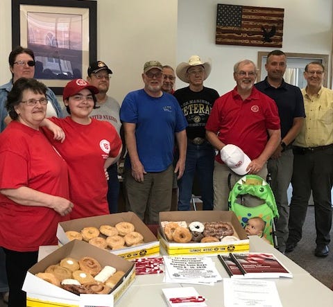 Logan County veterans enjoyed donuts from the Salvation Army Friday at the Veterans Assistance Commission in the John A. Logan building in Lincoln. [Photo by The Courier]