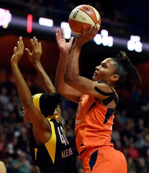 Connecticut Sun forward Alyssa Thomas shoots over Indiana Fever center Kayla Alexander (40) during a May 26 game in Uncasville. [Sean D. Elliot/The Day via AP]