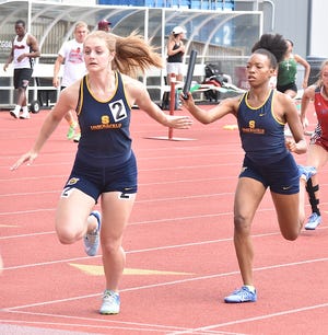 Streetsboro freshman Taylor Ivory hands off to sophomore Victoria Wagner as the Rockets' 4x200 relay took eighth at state.
