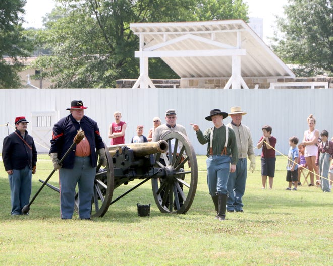 Civil War re-enactors prepare for a cannon live fire Saturday, June 2, 2018, at the Fort Smith National Historic Site as part of a Kids Cannon Class. Park Rangers offered an up-close view of the cannon and let them take part in a mock firing of the cannon. [JAMIE MITCHELL/TIMES RECORD]