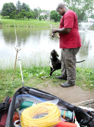 The fish may not have been biting but Kent White and his dog, "Paper," were still having a good time Friday afternoon at the Cambridge Duck Pond. Kent said he was using a variety of baits but was having no luck. He has caught other fish here this season including crappie, catfish and bass. The biggest fish he's pulled out of the water here was a carp weighing more than 15 pounds.