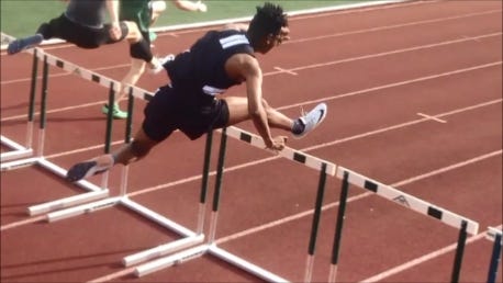 Cameron Rodgers, Durfee High junior, is in the home stretch of the 400-meter hurdles at Saturday's All State Track and Field Championships in Fitchburg. [Herald News photo]