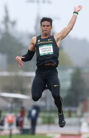 Oregon's Damarcus Simpson leaps during the Pepsi Team Invitational at Hayward Field in Eugene on Saturday, April 7, 2018. (Collin Andrew/The Register-Guard)
