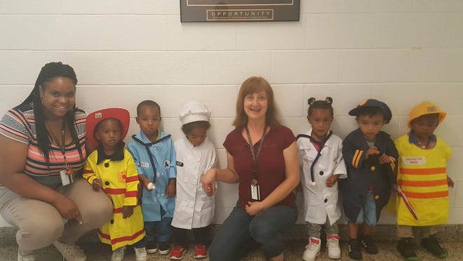 Ms. Barnes' and Ms. Julie's toddler classroom No. 3 from F.R. Danyus Child Development Center in New Bern recently celebrated community helpers. [CONTRIBUTED PHOTO]