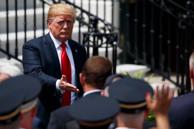 President Donald Trump shakes hands during a "Celebration of America" event at the White House, Tuesday, June 5, 2018, in Washington, in lieu of a Super Bowl celebration for the NFL's Philadelphia Eagles that he canceled. (AP Photo/Evan Vucci)