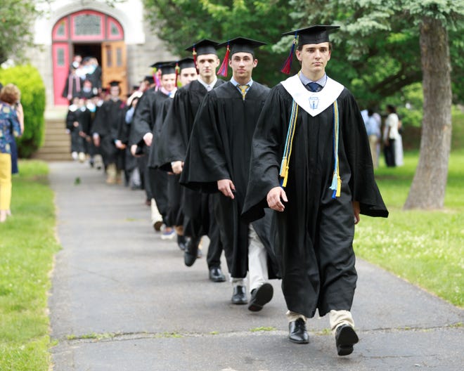 Holy Ghost Preparatory School seniors walk into Saturday's graduation at the Bensalem school. A total of 117 diplomas were handed out. [COURTESY OF HOLY GHOST PREPARATORY SCHOOL]
