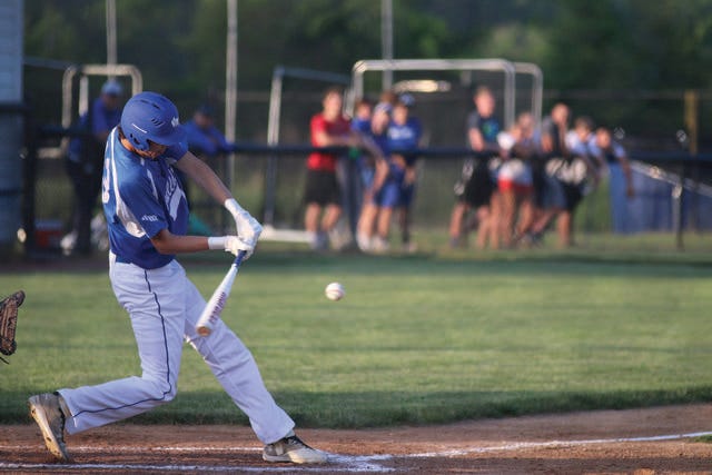 Van Meter’s Marshall Smith with a hit during the home opener against Ogden on Thursday, May 24. PHOTO BY ANDREW BROWN/DALLAS COUNTY NEWS