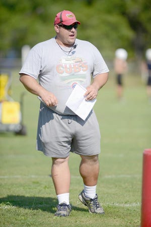 Carey Nick, the Daily News Wrestling Coach of the Year, has helped coach the football team in past seasons. [FILE PHOTO/DAILY NEWS]
