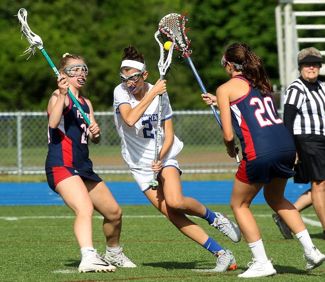 Braintree's Olivia Balsamo weaves through the defense of Pembroke's Caitlyn Pekrul and Morgan Cassaford during first-half action of their game in the first round of the Division 1 south girls lacrosse tournament at Braintree High on Tuesday, June 5, 2018. [Wicked Local Staff Photo/ Robin Chan]