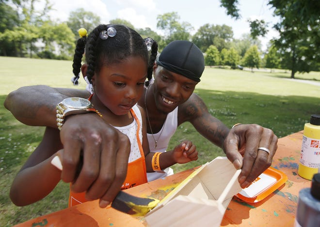 Edgar Thomas helps his daughter, Destini Thomas, 4, paint a wooden toolbox at the Home Depot table during the fifth annual Fathers in the Park held by Tuscaloosa's One Place at Annette Shelby Park in Tuscaloosa on Saturday, June 10, 2017.  [Staff Photo/Erin Nelson]