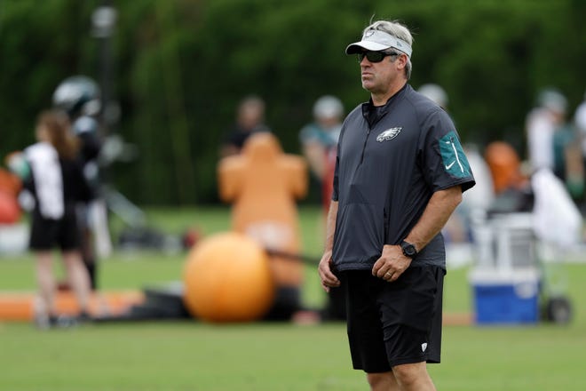 Eagles head coach Doug Pederson watches a drill during an organized team activity at the team's facility Wednesday in Philadelphia. [MATT SLOCUM / ASSOCIATED PRESS]