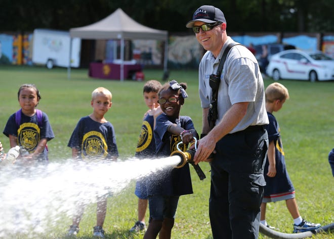 The annual — and free — Cops, Kids and Firefighters Day runs July 19. [Bruce Ackerman/File photo]