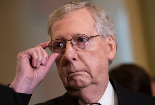 Senate Majority Leader Mitch McConnell tells reporters he intends to cancel the traditional August recess and keep the Senate in session to deal with backlogged tasks, on Capitol Hill on Tuesday in Washington. [J. Scott Applewhite/The Associated Press]