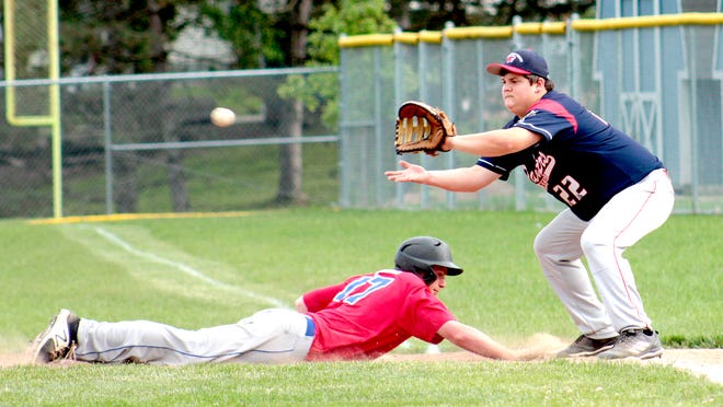 Cambridge Post 84's Clark Jennings (17) jumps back to first base safely during their game against Tuscarawas County The Panthers Post 205 on Wednesday evening. Also pictured is Tuscarawas County Post 205's Nate Novak (22).