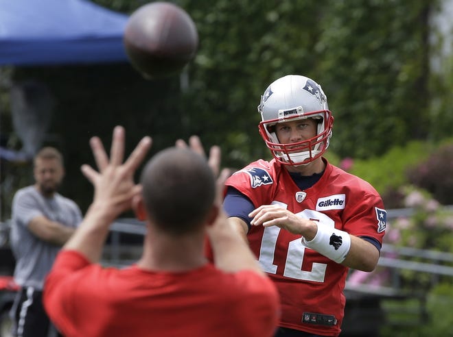 Patriots quarterback Tom Brady throws the ball during a minicamp practice on Thursday in Foxboro. [STEVEN SENNE/THE ASSOCIATED PRESS]