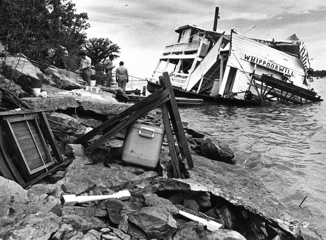 Sixteen people were killed June 17, 1978, when a small tornado struck this paddle-wheel replica of an old-fashioned riverboat called the Whippoorwill on Lake Pomona, about 35 miles south of Topeka. This photo was taken the following day after the showboat was righted and towed in to shore. [Topeka Capital-Journal file photo]