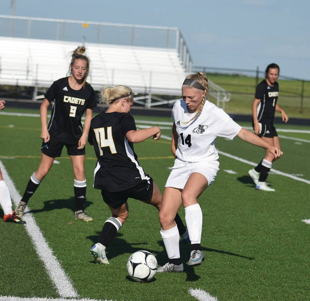North Polk’s Jalen Heintz dribbles the ball past Iowa Falls-Alden’s Makenna Meyer on her way toward the goal during the first half of the Comets’ 5-0 Class 1A regional semifinal win over the Cadets Friday at Comet Field in Alleman. North Polk went on to upset No. 5 Denver, 2-1, in the regional finals on Monday at Denver to advance to state for the second year in a row. North Polk (14-5) faces No. 1 and defending state champion Davenport Assumption (15-2) in the 1A state quarterfinals at 11 a.m. today at the Cownie Soccer Park in Des Moines.