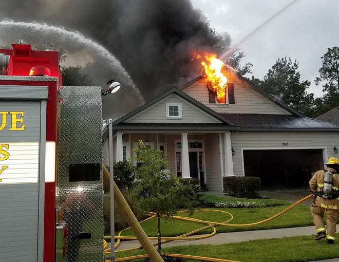 Firefighters battled a house fire in southwest Alachua County on Monday. [ACFR via Facebook]