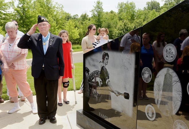 Hershal "Woody" Williams salutes during the dedication of the Gold Star Families Memorial Monument at Washington Crossing National Cemetery in Upper Makefield on Saturday. Williams, a World War II veteran and Medal of Honor recipient, has spearheaded the national effort to honor the Gold Star Families. [KIM WEIMER / STAFF PHOTOJOURNALIST]