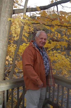 Bayou Bill Scifres on his back deck back in 2006 reminiscing on a half century of outdoor writing. [Submitted photo]