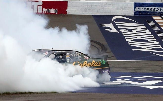 Austin Dillon burns out near the start-finish line after winning Saturday's NASCAR Xfinity Series race at Michigan International Speedway.