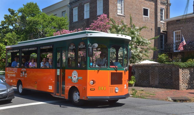 An Old Town Trolley tour bus rolls down Gordon Street. [Steve Bisson/savannahnow.com]