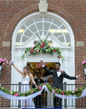 Rachel Anne Martin and Marcel Millstein make an entrance during Moorestown Friends School's 2018 commencement ceremony in Moorestown on Saturday, June 9, 2018. [WILLIAM THOMAS CAIN / PHOTOJOURNALIST]