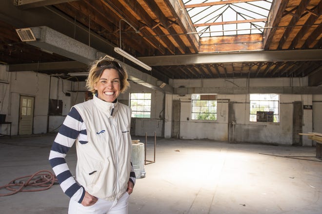 Jenni Laundon has a vision for transforming a former garage for Competition Imports into the new home of E. Frances Paper. [DAVE HANSEN/STAFF PHOTOGRAPHER]