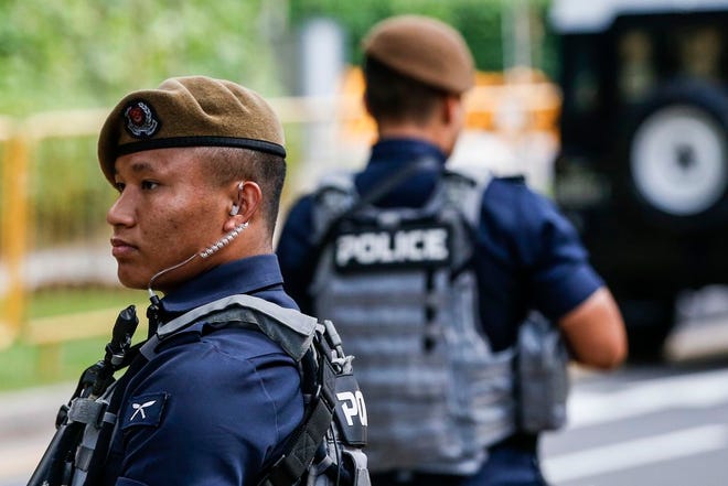 Gurkha police officers guard the perimeter of the Shangri-La Hotel in Singapore, Sunday, June 10, 2018, ahead of the summit between U.S. President Donald Trump and North Korean leader Kim Jong Un. (AP Photo/Yong Teck Lim)