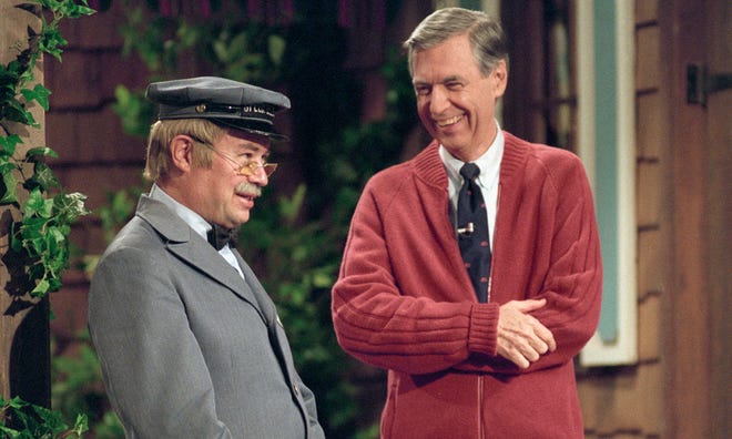 This image released by Focus Features shows David Newell, as Mr. McFeely, left, and Fred Rogers on the set of "Mister Rogers' Neighborhood," from the film, "Won't You Be My Neighbor." (Lynn Johnson/Focus Features via AP)