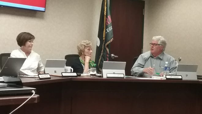 From left, Southeastern Community College chairwoman Chris Prellwitz, vice chairwoman Janet Fife-LaFrenz and trustee Jeff Helland discuss tuition hikes Monday in the boardroom at SCC in West Burlington. [Michaele Niehaus-Steffensmeier/thehawkeye.com]