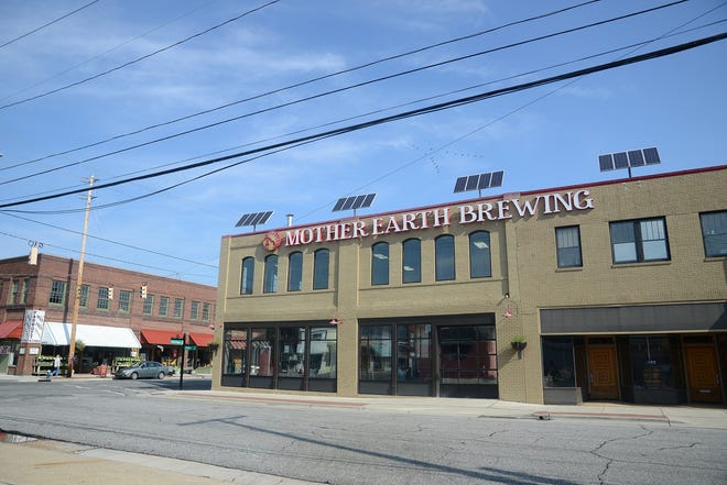 Solar panels are mounted on the roof of Mother Earth Brewing on North Herritage Street in Kinston. Mother Earth Spirits is a a LEED certified solar building. Photo by Janet S. Carter / The Free Press