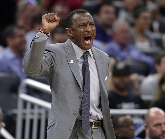 Dwane Casey directs his players during a NBA game against the Orlando Magic last season. The Detroit Pistons have agreed to a five-year contract with coach Casey. [AP PHOTO/JOHN RAOUX]