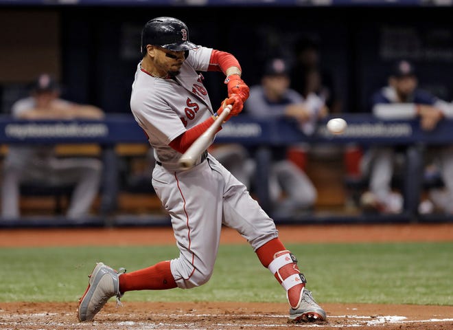 Mookie Betts connects for a three-run homer off Tampa Bay's Jacob Faria in the third inning on May 22.